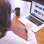 a lady sitting on her laptop showing strategies for business website content
